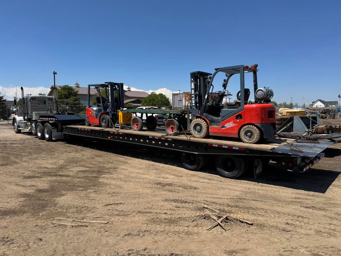 Chuck's Towing heavy equipment loading